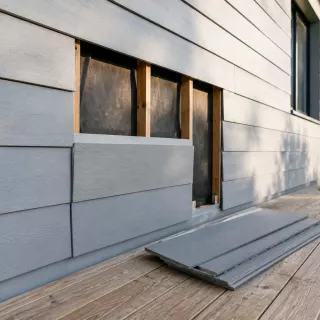 Image générée : Réparation de bardage sur maison moderne